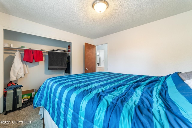 8764 Trinity Dr, Juneau, AK 99801 - carpeted bedroom with a textured ceiling