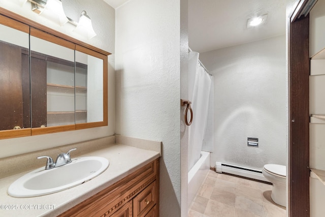 8764 Trinity Dr, Juneau, AK 99801 - bathroom featuring a textured wall, vanity, baseboard heating, and shower / tub combo
