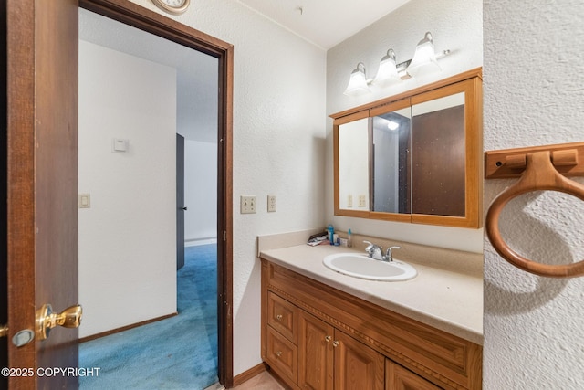 8764 Trinity Dr, Juneau, AK 99801 - bathroom featuring vanity and a textured wall