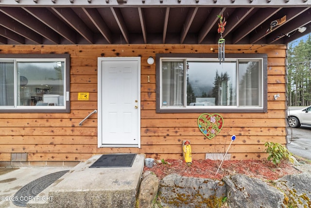 8764 Trinity Dr, Juneau, AK 99801 - view of exterior entry featuring crawl space