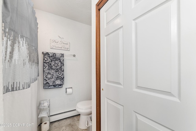 8764 Trinity Dr, Juneau, AK 99801 - full bathroom with a baseboard radiator and toilet