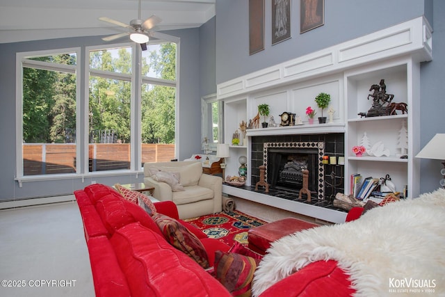 4450 Trapline Dr, Anchorage, AK 99516 - living room featuring a tiled fireplace, ceiling fan, and plenty of natural light