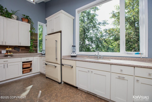 4450 Trapline Dr, Anchorage, AK 99516 - kitchen featuring white refrigerator, white cabinets, and light stone countertops