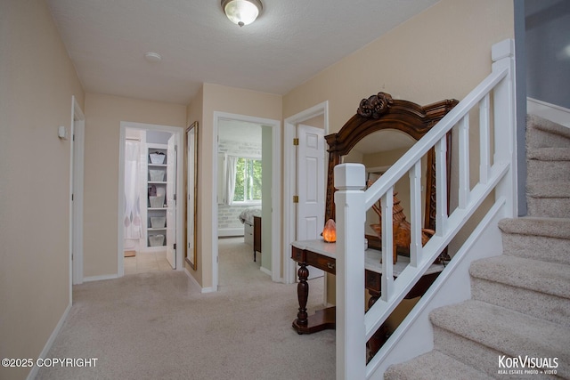 4450 Trapline Dr, Anchorage, AK 99516 - stairs featuring carpet flooring and a textured ceiling