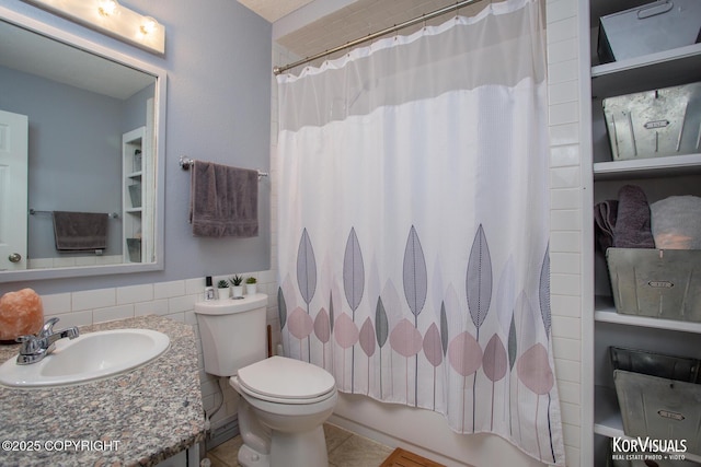 4450 Trapline Dr, Anchorage, AK 99516 - full bath featuring vanity, shower / bath combo with shower curtain, and tile patterned floors