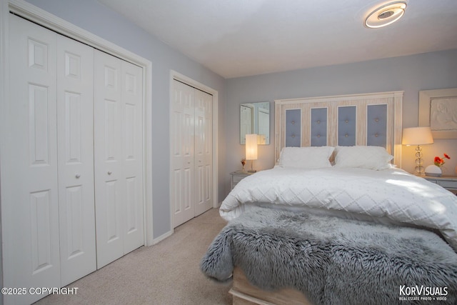 4450 Trapline Dr, Anchorage, AK 99516 - bedroom featuring light colored carpet and multiple closets