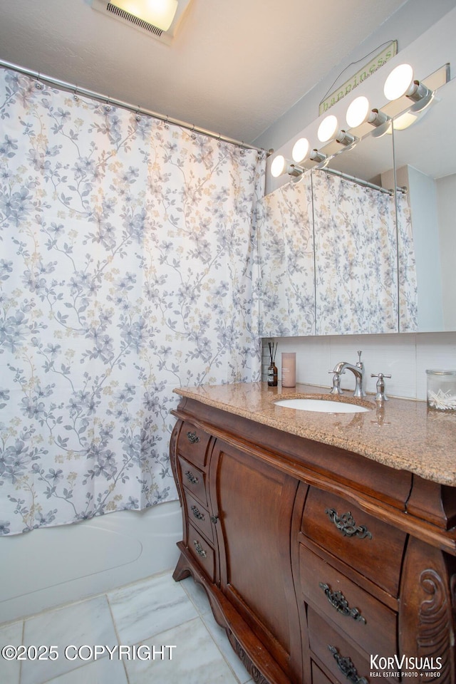 4450 Trapline Dr, Anchorage, AK 99516 - bathroom with vanity and shower / bath combination with curtain