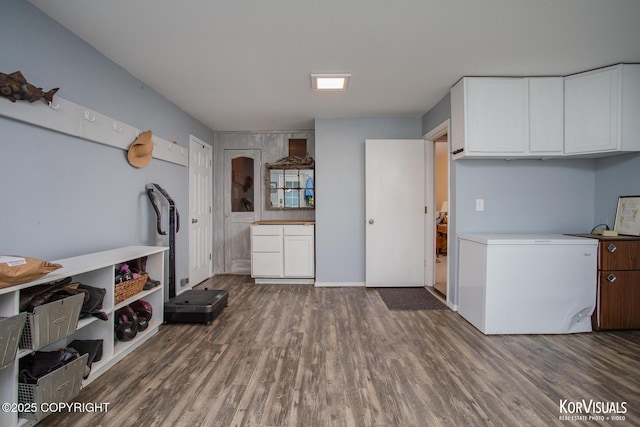 4450 Trapline Dr, Anchorage, AK 99516 - kitchen with refrigerator, wood finished floors, white cabinets, and light countertops