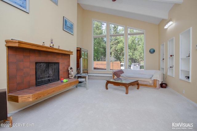 4450 Trapline Dr, Anchorage, AK 99516 - carpeted living room featuring a tile fireplace, beam ceiling, and high vaulted ceiling