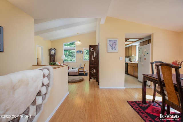 4450 Trapline Dr, Anchorage, AK 99516 - corridor featuring vaulted ceiling and light wood-style flooring