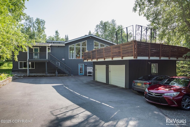 4450 Trapline Dr, Anchorage, AK 99516 - view of front of home featuring a garage and driveway