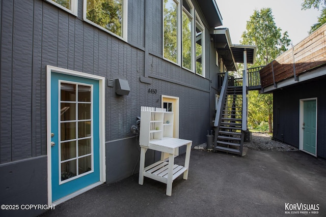 4450 Trapline Dr, Anchorage, AK 99516 - view of side of property featuring stairway and a patio area