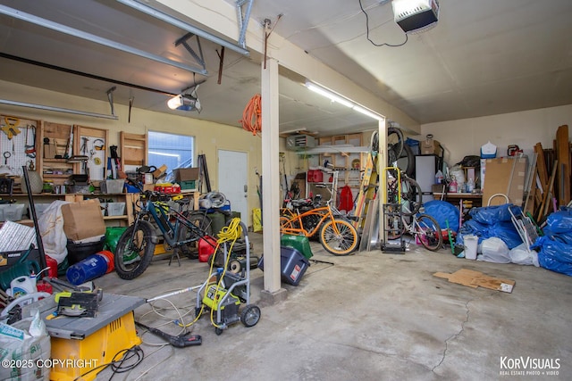4450 Trapline Dr, Anchorage, AK 99516 - garage with a garage door opener and a workshop area