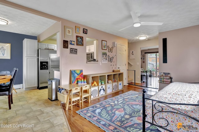 1124 Fred Cir, Anchorage, AK 99515 - bedroom featuring stainless steel refrigerator with ice dispenser and baseboards