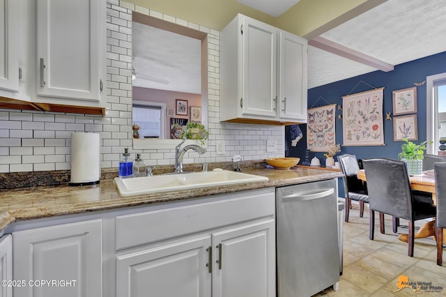 1124 Fred Cir, Anchorage, AK 99515 - kitchen featuring dishwasher, white cabinets, backsplash, and light stone countertops