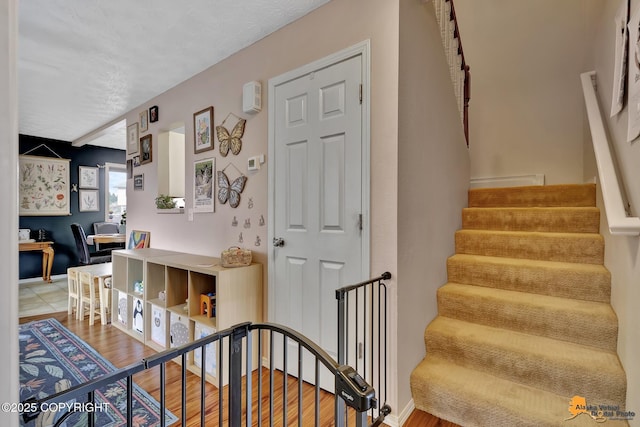 1124 Fred Cir, Anchorage, AK 99515 - stairs with wood finished floors and baseboards