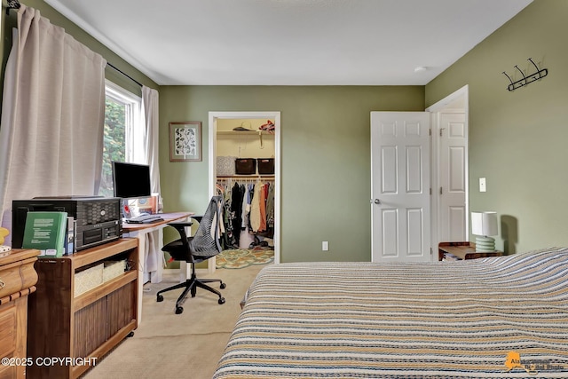 1124 Fred Cir, Anchorage, AK 99515 - bedroom with light colored carpet, a spacious closet, and a desk