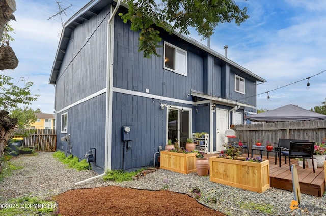 1124 Fred Cir, Anchorage, AK 99515 - back of house featuring a deck