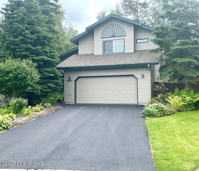 4032 Justin Cir, Anchorage, AK 99507 - view of front facade with a garage and asphalt driveway