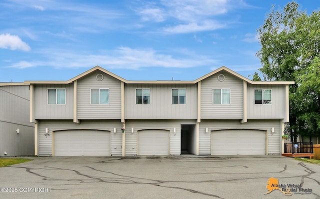 12231 Johns Rd # 2, Anchorage, AK 99515 - view of front of home with an attached garage and driveway