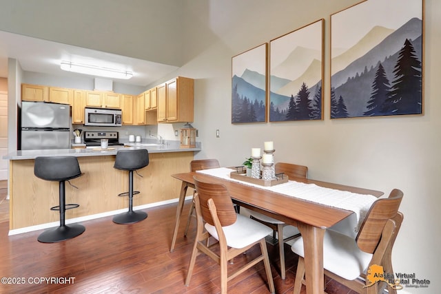 12231 Johns Rd # 2, Anchorage, AK 99515 - dining room featuring dark wood-type flooring