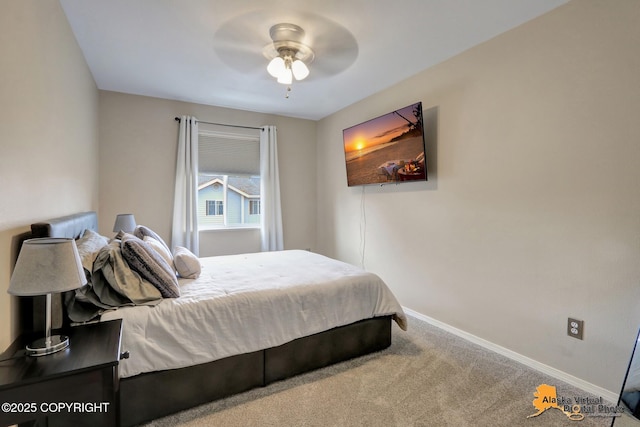 12231 Johns Rd # 2, Anchorage, AK 99515 - carpeted bedroom with baseboards and a ceiling fan