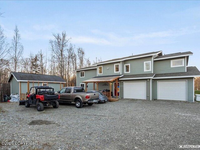 3872 N Charley Dr, Wasilla, AK 99654 - townhome / multi-family property with driveway and an attached garage