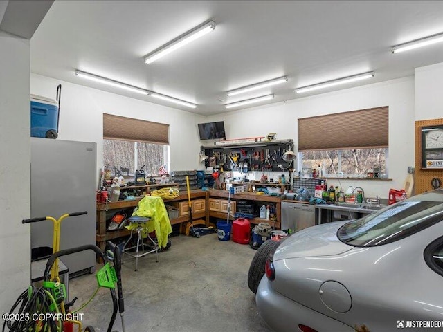 3872 N Charley Dr, Wasilla, AK 99654 - garage with a workshop area and freestanding refrigerator