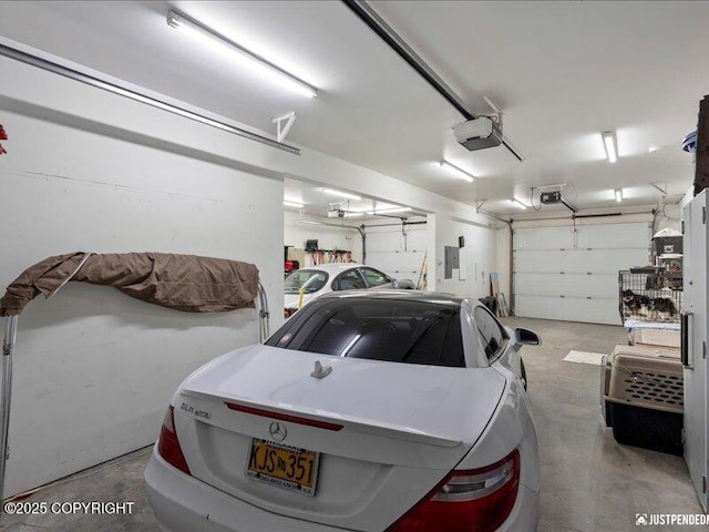 3872 N Charley Dr, Wasilla, AK 99654 - garage featuring a garage door opener and electric panel