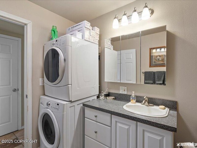 3872 N Charley Dr, Wasilla, AK 99654 - laundry room with stacked washer / drying machine and light tile patterned floors
