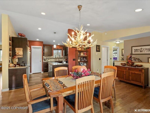 3872 N Charley Dr, Wasilla, AK 99654 - dining room featuring a chandelier, wood finished floors, and recessed lighting