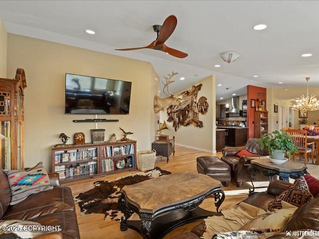 3872 N Charley Dr, Wasilla, AK 99654 - living room with light wood-type flooring, recessed lighting, a chandelier, and a ceiling fan
