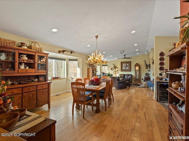 3872 N Charley Dr, Wasilla, AK 99654 - dining area featuring a chandelier, light wood-style floors, beverage cooler, and recessed lighting