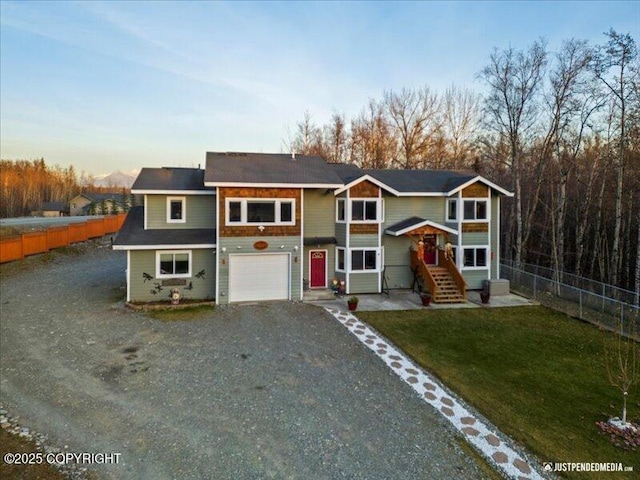 3872 N Charley Dr, Wasilla, AK 99654 - view of front of property with gravel driveway and an attached garage