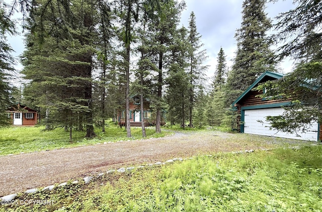 15700 Wild Salmon Way, Ninilchik, AK 99639 - view of yard featuring an outbuilding and driveway