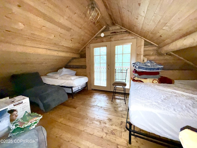 15700 Wild Salmon Way, Ninilchik, AK 99639 - bedroom with hardwood / wood-style floors, wooden ceiling, vaulted ceiling, and access to exterior