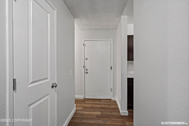3100 Ward Pl Unit 6, Anchorage, AK 99517 - corridor featuring a textured ceiling and wood finished floors