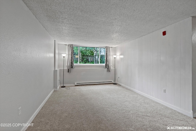3100 Ward Pl Unit 6, Anchorage, AK 99517 - carpeted spare room with a textured ceiling and baseboard heating