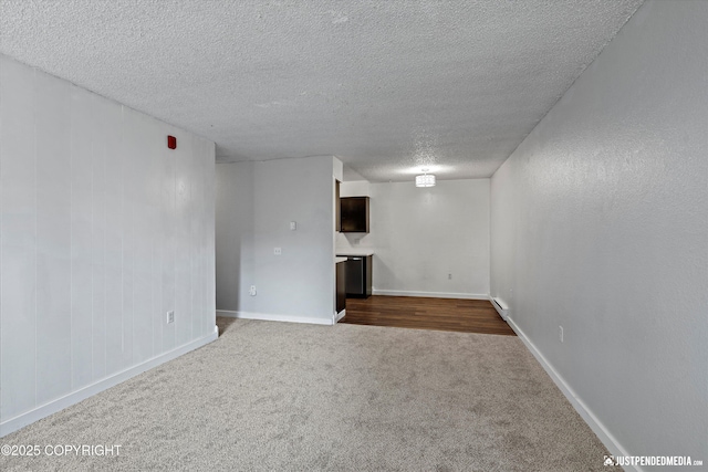3100 Ward Pl Unit 6, Anchorage, AK 99517 - spare room with a textured ceiling and dark colored carpet