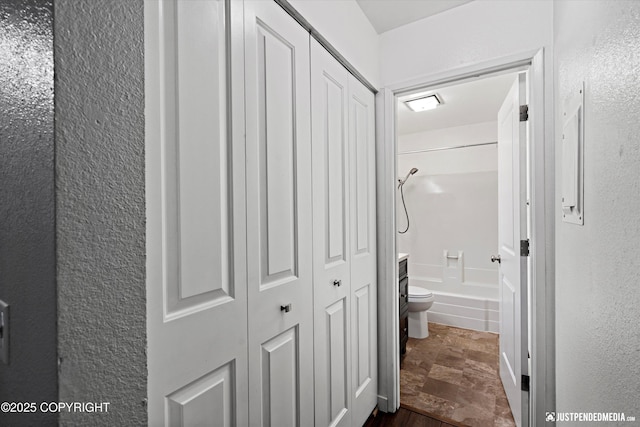 3100 Ward Pl Unit 6, Anchorage, AK 99517 - hall with stone finish floors and a textured wall