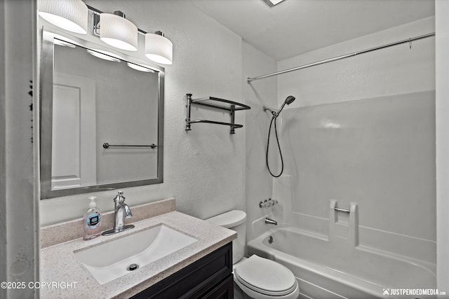 3100 Ward Pl Unit 6, Anchorage, AK 99517 - bathroom featuring a textured wall, bathtub / shower combination, and vanity