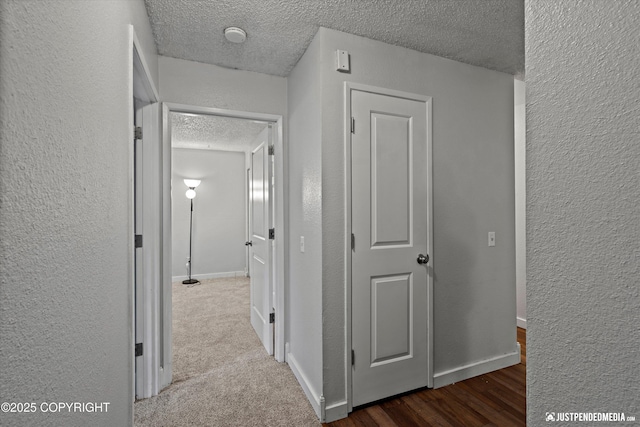 3100 Ward Pl Unit 6, Anchorage, AK 99517 - corridor with a textured ceiling, a textured wall, and wood finished floors