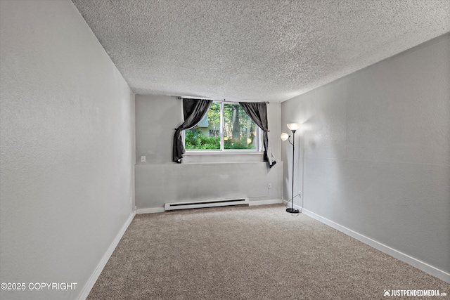 3100 Ward Pl Unit 6, Anchorage, AK 99517 - carpeted empty room featuring a baseboard heating unit and a textured ceiling