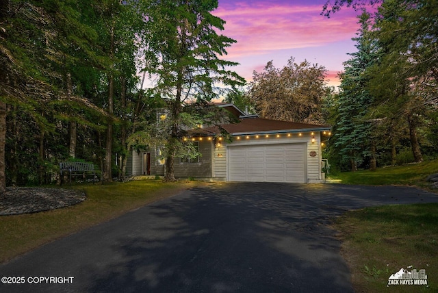 250 Botanical Cir, Anchorage, AK 99515 - view of front of home with asphalt driveway, a garage, and a front yard