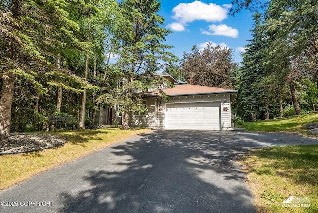 250 Botanical Cir, Anchorage, AK 99515 - view of front of house featuring driveway, an attached garage, and a front yard