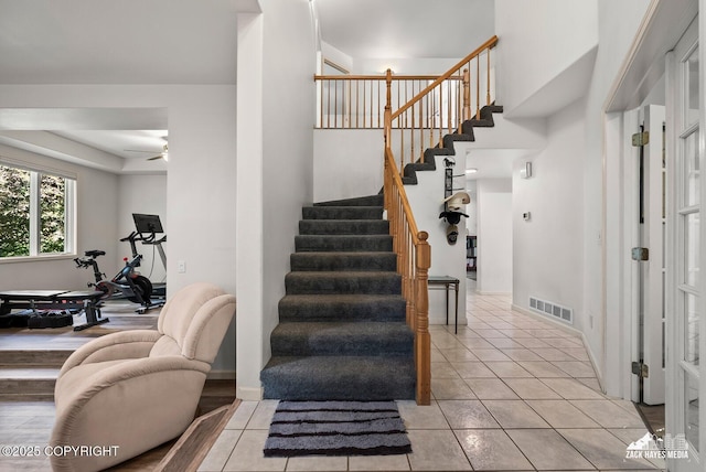 250 Botanical Cir, Anchorage, AK 99515 - staircase with a ceiling fan and tile patterned flooring