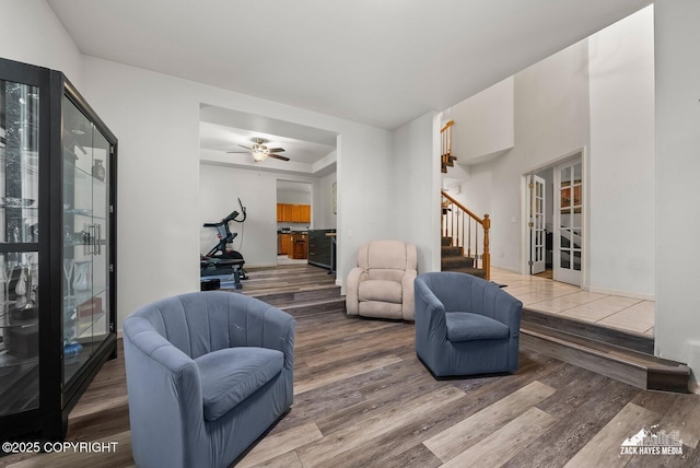 250 Botanical Cir, Anchorage, AK 99515 - living room featuring wood finished floors, stairs, french doors, and ceiling fan
