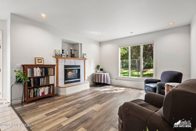 250 Botanical Cir, Anchorage, AK 99515 - living room featuring a tile fireplace, wood finished floors, and recessed lighting