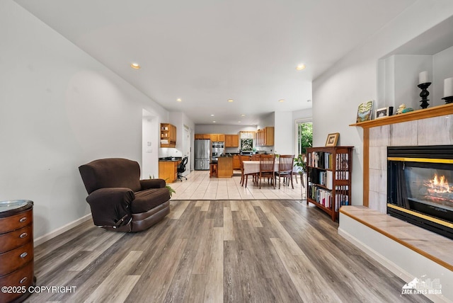 250 Botanical Cir, Anchorage, AK 99515 - living room with light wood-style floors, a fireplace, and recessed lighting