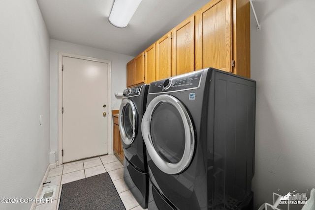 250 Botanical Cir, Anchorage, AK 99515 - laundry room featuring separate washer and dryer, cabinet space, and light tile patterned flooring